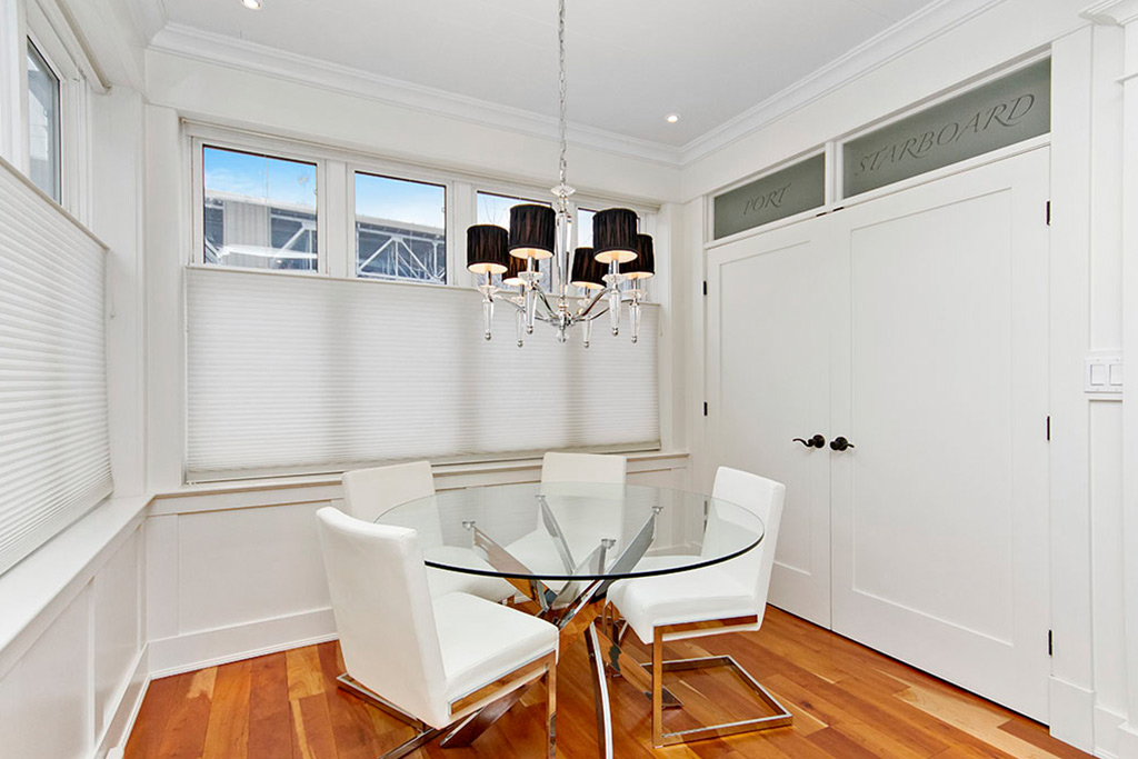 Dining room of beautifully renovated semi-detached Burlington home rental with lake views.